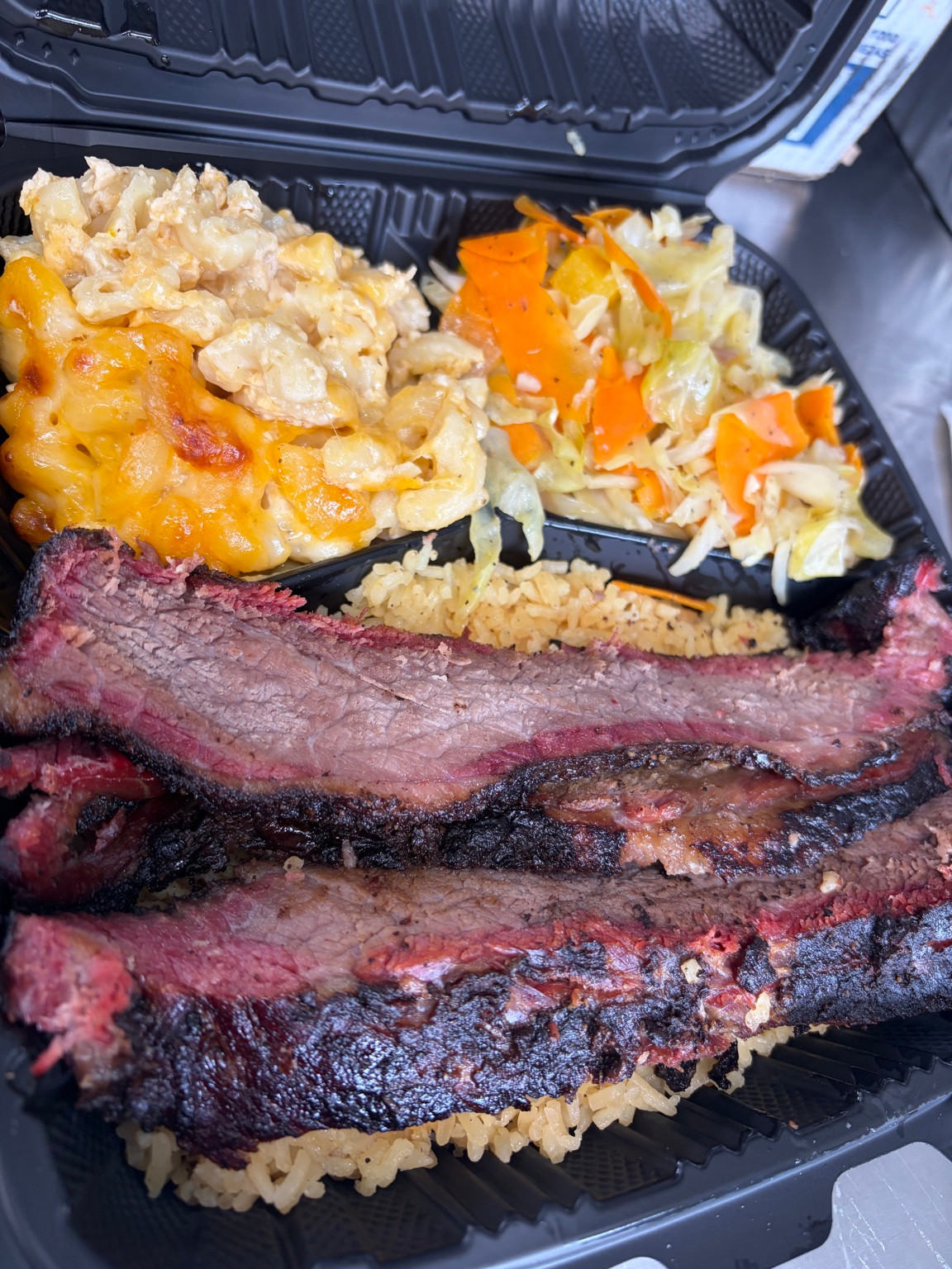 Little Back brisket with rice and sides, owner photo